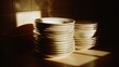 © GATE 22 - Stack of white bowls on a kitchen countertop. the bowls are arranged in a neat stack, with the largest bowl at the bottom and the smallest at the top.