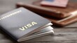 © lililia - This close-up shows a passport with a visa on a background of an American flag, highlighting elements of travel and identification