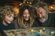 © Vasiliy - Happy family playing board game at home, happiness concept