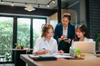 © mojo_cp - Female leader guiding new staff member at office with career advice and skill development discussion