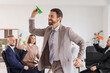 © Pixel-Shot - Funny businessman with paper plane in office