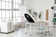 © Pixel-Shot - Interior of pediatrician's office with couch and plants