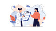 © Nitu - A female doctor in a white coat holding a clipboard and discussing a health checklist with a female patient during a medical consultation.