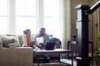 © BuyoutReese07/peopleimages.com - Smile, couple and tablet with document in home for finance report, mortgage and online payment. Happy, people and tech with financial paperwork, review budget and bank statement on household expenses