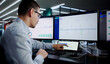© Andrey Popov - Busy Hispanic IT Specialist Multitasking