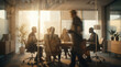© Starmarpro - Blurred Background of Business Professionals Having a Collaborative Meeting in a Sunlit Office