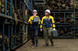 © BESTIMAGE - Two female engineers in safety gear inspecting car parts inventory. workers technical walking old dirty car industry checking used auto parts by tablet industrial automotive parts warehouse Recycling