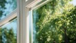 © backup_studio - Close up of a modern window frame with sun shining through. Fresh air and nature outside with green trees. Concept for home insulation and bright living space.