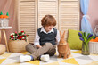 © New Africa - Little boy with cute Easter bunny indoors