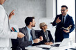 © Novak - Diverse business group having a productive meeting in a modern office.