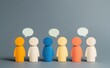© Arfa_Media - Multicolored wooden figures representing different people interacting and having a dialogue, showing communication, teamwork, and opinion exchange