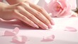 © Style Studio - Elegant hands with delicate pink nail polish, adorned with soft pink rose petals scattered around, evoking a sense of beauty and grace.