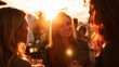 © Sajib - Three young women enjoying drinks and conversation at sunset outdoors together