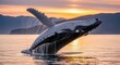 © MdMohiuddin - Humpback whale breaching in serene waters at sunset