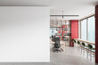 © ImageFlow - Modern office interior with blank white wall for poster mockup and open space layout with workstations and red accent walls in background. 3D Rendering