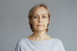 © evafesenuk - Portrait of a mature woman with a calm confident expression. Concept of natural beauty, healthy aging, lifestyle, and authenticity.