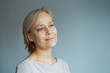 © evafesenuk - Portrait of a mature woman with a calm confident expression. Concept of natural beauty, healthy aging, lifestyle, and authenticity.
