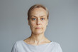 © evafesenuk - Portrait of a mature woman with a calm confident expression. Concept of natural beauty, healthy aging, lifestyle, and authenticity.