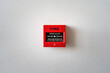 © Nattawit - Fire alarm box on white wall, breaking glass and push the button to activate sound alarm. Safety equipment object for building place. Close-up.