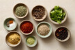 © krasyuk - Spices and herbs arranged in bowls on a table for cooking preparation in a kitchen setting