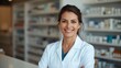 © LimeSky - Confident Hispanic female pharmacist in her middle age smiling at the pharmacy