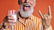 © Karen - Playful senior man with milk funny confident aging portrait