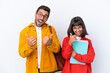 © luismolinero - Young student couple isolated on white background giving a thumbs up gesture with both hands and smiling