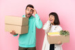 © luismolinero - young beauty couple moving in new home among boxes isolated on pink background with surprise and shocked facial expression