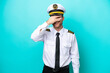 © luismolinero - Airplane caucasian pilot isolated on blue background covering eyes by hands and smiling