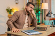 © Andrii Iemelianenko - Sad Caucasian businessman looks pensive thinks over life concerns or unrequited love, suffers from unfair situation. Problem, break up, depressed feeling bad, burnout. Guy at home office at table.