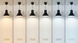 © tonstock - Six black led lamp pendants showing a range of color temperature from warm to cool illumination.