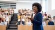 © ryker - Confident female speaker addressing diverse audience in modern lecture hall, engaging students and smiling while holding microphone in professional presentation