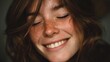 © mila103 - Smiling caucasian young female with freckles and wavy hair.