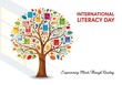 © Rima Akter - International literacy day poster with a tree made of books and colorful leaves on white background