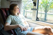 © Aleksej - Female passenger relaxing in comfortable sleeper bus seat during long distance travel in Asia