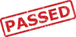 © FEROZA - This image presents a weathered red rectangular stamp with the word PASSED clearly visible against a bright white backdrop