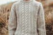 © nsit0108 - Stylish man wearing a warm cable knit sweater in a fall field of dry grass