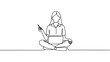 © Azmat Ullah - A woman sits cross-legged on the floor with a laptop and phone in a minimalist setting.