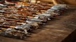 © you are doing great! - Close up of traditional metal arrowheads with wooden shafts, historical archery weapons arranged on dark surface, medieval craftsmanship concept