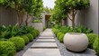 © buraratn - Tranquil Pathway Through Lush Green Garden with Marble Planters and Stone Walkway Surrounded by Vibrant Foliage in a Serene Outdoor Space