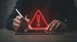© MDALIF - A person interacting with a tablet displaying a warning sign
