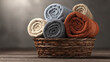 © Thiago - Rolled towels in a wicker basket on a wooden surface, evoking a sense of comfort and relaxation