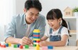 © Generative AI - Father and Daughter Building Colorful Blocks Together, Spending Quality Time at Home, Smiling and Laughing