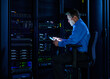 © Tetra Images - Man using digital tablet in data center