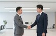 © Generative AI - Two Asian businessmen shaking hands in modern office environment, symbolizing partnership, agreement and successful deal