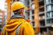 © Putra - Engineer Overseeing Construction Site from Back View with Massive Structures
