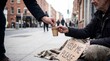 © Sabrina - Person giving money to a homeless man on a city street.