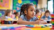 © VIKI - The girl concentrating while writing with a pencil in a bright elementary classroom