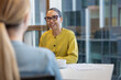 © ReeldealHD images - Senior businesswoman listening in a business meeting