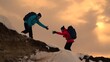 © Victoriia - Hikers climb snow-covered mountain, rock climbers extend their hands to each other as they reach top hill. Team businessmen wins. Teamwork business people. Reach your goal. Women travelers backpacks